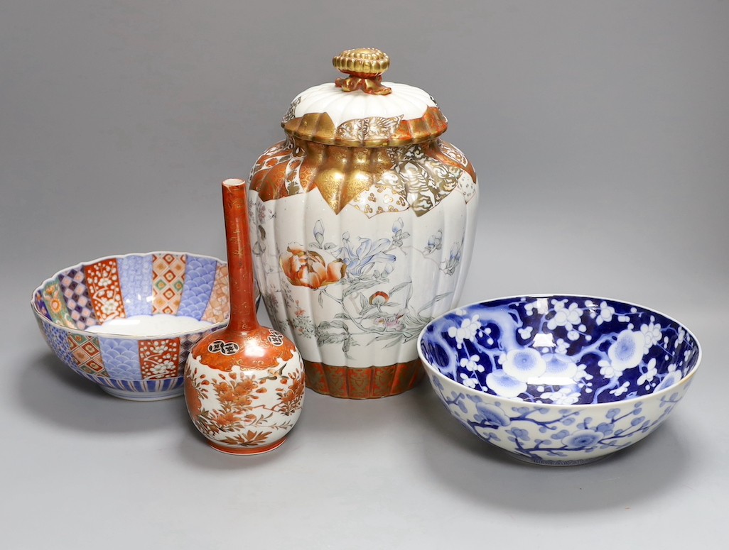 A Japanese kutani bottle vase, similar vase and cover (a.f), an Imari bowl and blue and white bowl. Largest 27cm